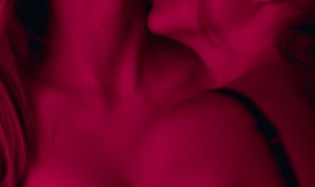 two woman wearing brassieres